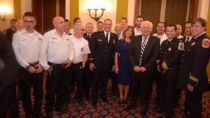 U.S. and Israeli first responders gather around U.S. Ambassador David Friedman at an ASTI dinner and awards ceremony held in their honor. Credit: Binyamin Ben Kahlon 