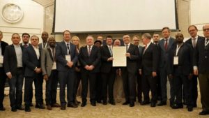 Faith-based pro-Israel parliamentarians in Jerusalem for the Israel Allies Foundation’s (IAF) annual Chairman’s Conference hand a resolution calling for elected officials worldwide to oppose the BDS movement to Likud Party Knesset member Gideon Sa'ar, December 2019. Credit: Jerusalem East Gate Foundation.