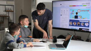 Israeli youths during a remote learning session at their home in Moshav Yashresh on March 18, 2020. Photo by Yossi Aloni/Flash90.