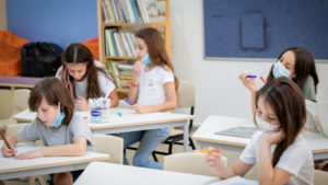 Illustration of Israeli students wearing protective face masks, in order to prevent the spread of the Coronavirus, in a school in Tel Aviv. AUgust 23, 2020. Photo by Chen Leopold/FLASH90