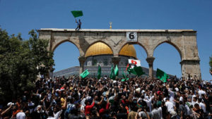 Palestinians gather on the Temple Mount, some holding Hamas flags, on May 7, 2021. Photo by Jamal Awad/Flash90.