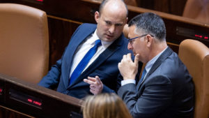 Israeli Prime Minister Naftali Bennett with Minister of Justice Gideon Saar during a swearing in ceremony of new Israeli parliament members at the Knesset, the Israeli parliament in Jerusalem, June 16, 2021. Photo by Yonatan Sindel/Flash90