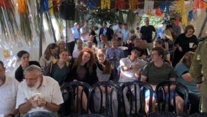 Efrat residents gather in the city's Sukkah of Peace, October 16, 2022. Credit: Josh Hasten.